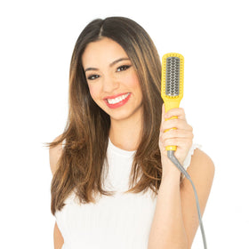 Drybar Baby Brush Crush Mini with ionic smoothing technology for frizz control.