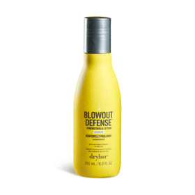 Drybar Blowout Defense Shampoo bottle pour highlights easy application and long-lasting blowouts.