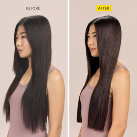 Hair during blowout process using Drybar Liquid Glass for frizz protection.