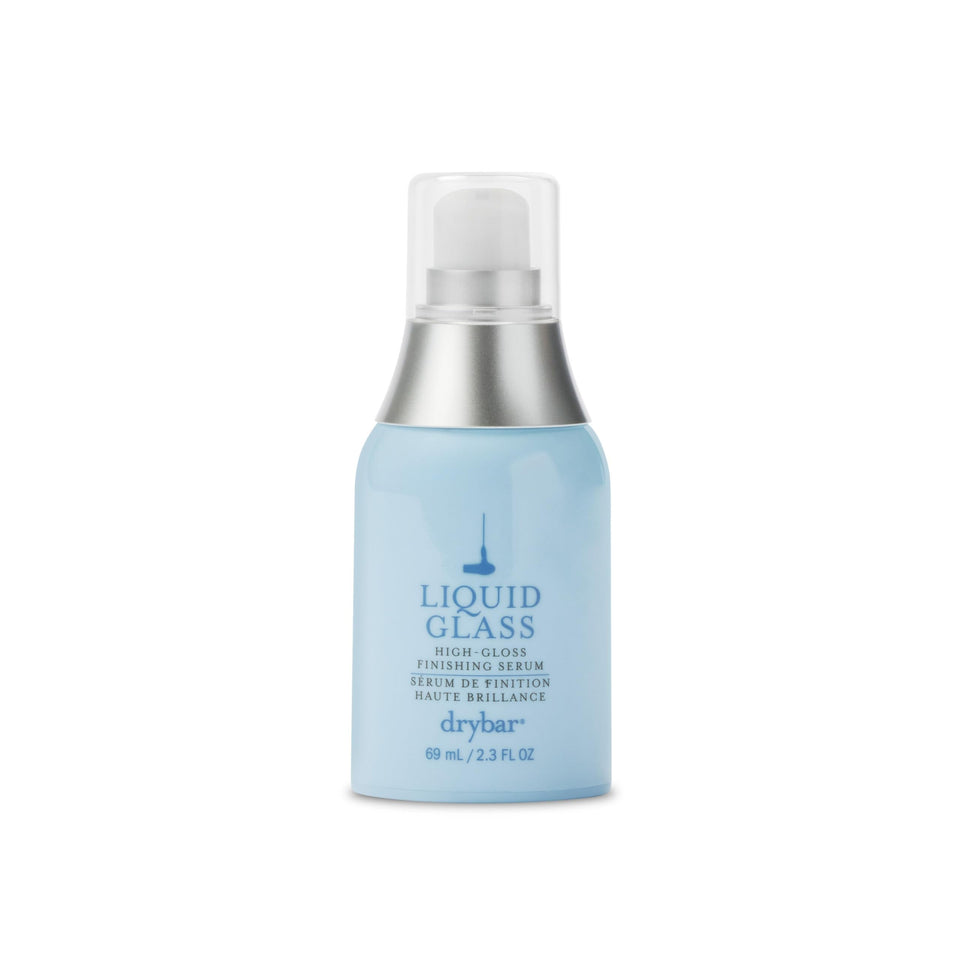 Drybar Liquid Glass bottle pour demonstrates controlled dispensing for easy application.