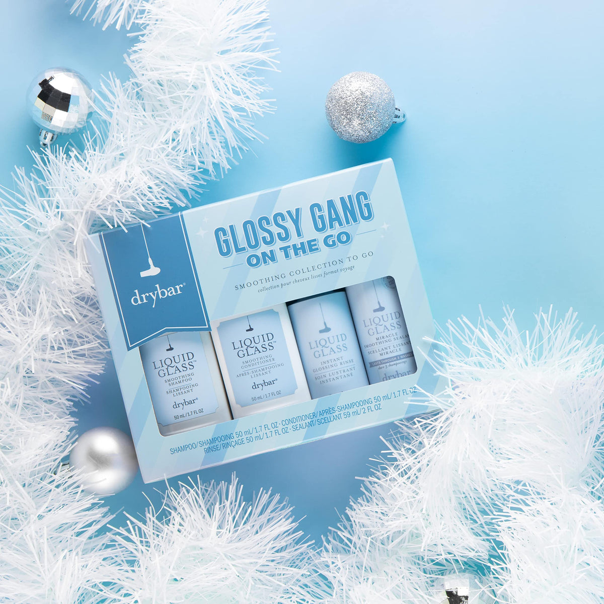 Drybar Liquid Glass instant glossing rinse travel-size bottle for quick high shine.
