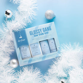 Drybar Liquid Glass instant glossing rinse travel-size bottle for quick high shine.