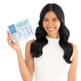 Drybar Liquid Glass smoothing conditioner travel-size bottle for detangled, shiny hair.
