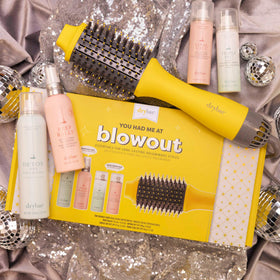 Drybar Prep Rally Prime & Prep Detangler for smoother detangling.