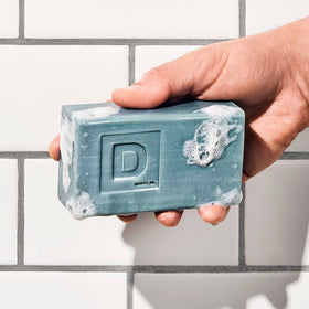 Duke Cannon bar soap collection arranged neatly for three-pack showcase.