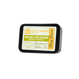 Duke Cannon Bay Rum solid cologne cedarwood note for depth.