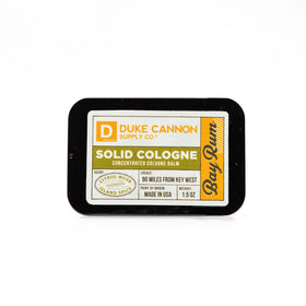 Duke Cannon Bay Rum solid cologne citrus musk note for daytime freshness.