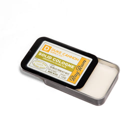 Duke Cannon Bay Rum solid cologne packaging with clear branding.