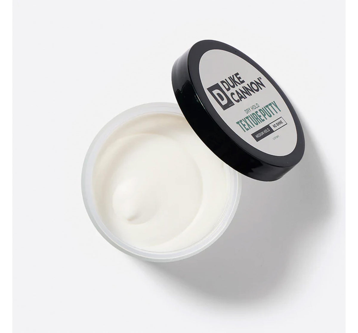 Duke Cannon Dry Hold Texture Putty hands warm demonstrates smooth, even distribution.