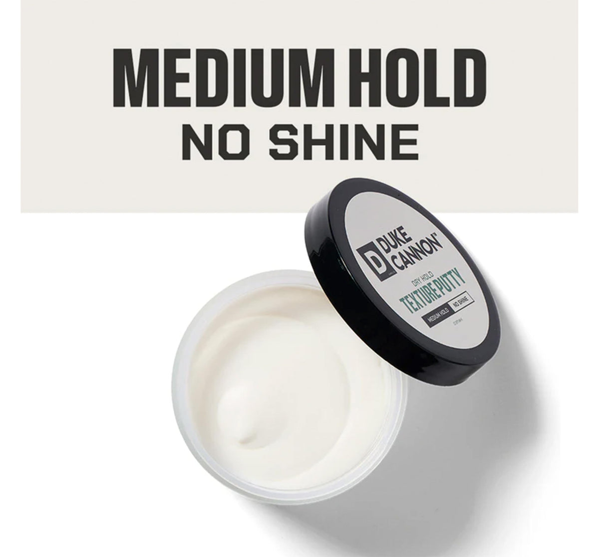 Duke Cannon Dry Hold Texture Putty jar closeup highlights creamy texture for easy application.