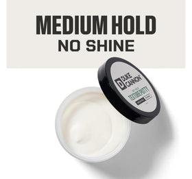 Duke Cannon Dry Hold Texture Putty jar closeup highlights creamy texture for easy application.