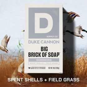 Duke Cannon Gun Smoke soap bar charred leather note for lasting masculinity.