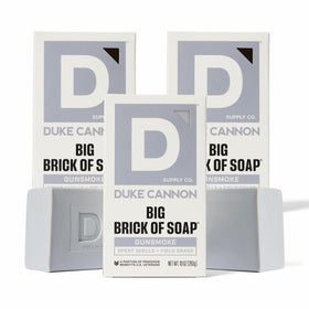Duke Cannon Gun Smoke soap bar wood scent for rugged cleansing and freshness.