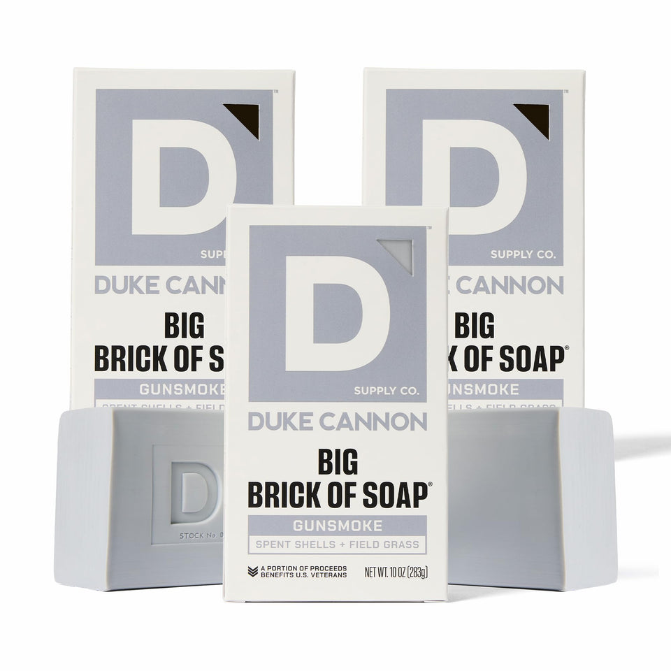 Duke Cannon Gun Smoke soap bar wood scent for rugged cleansing and freshness.
