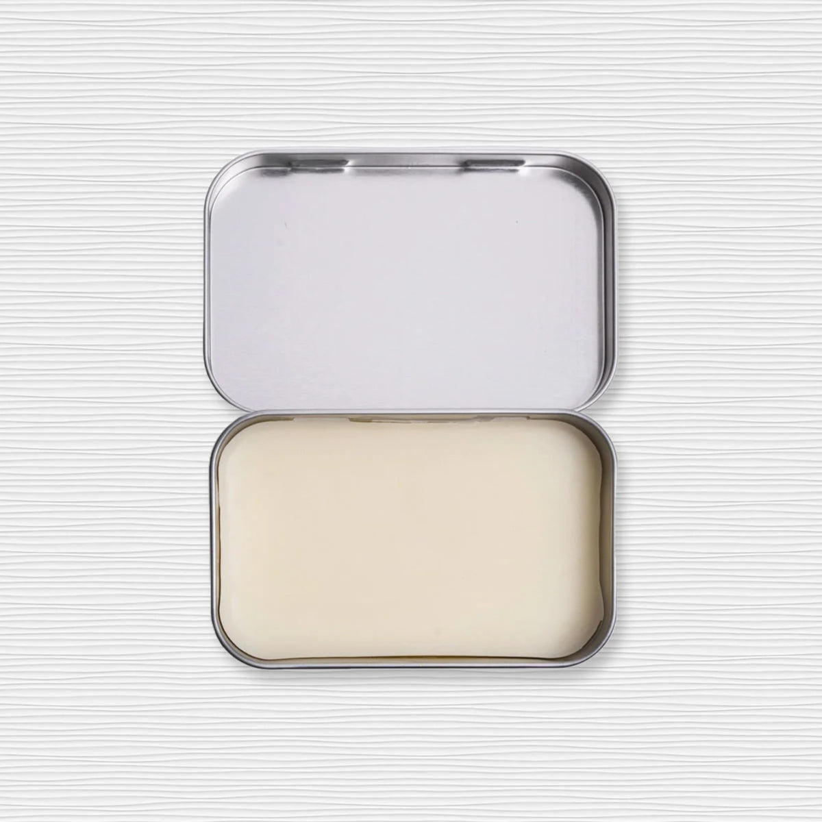 Duke Cannon Old Glory solid cologne on wrist demonstrates discrete scent upgrade.