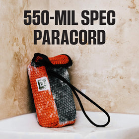 Duke Cannon Tactical Scrubber 550-mil-spec paracord keeps soap elevated off the ground.