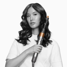 Dyson Airwrap Origin round volumizing brush adds body as it dries.
