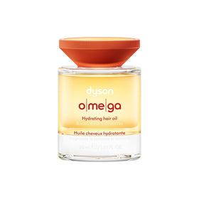 Dyson Omega Hydrating Hair Oil bottle demonstrates premium packaging and frizz-taming potential.