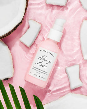 Close-up of hibiscus and seaweed ingredients in Earth Harbor Ahoy Love Nourishing Cream Cleanser.