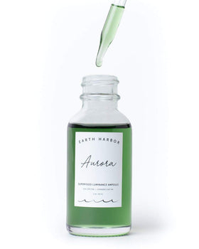 Earth Harbor AURORA ampoule application shows precise drop for targeted care.