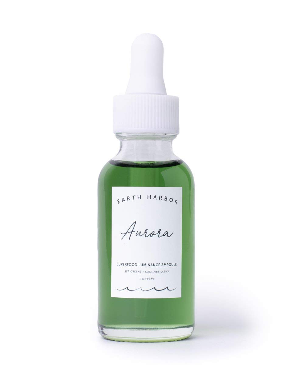 Earth Harbor AURORA bottle glow suggesting nourishing skin during routine.
