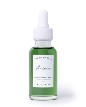 Earth Harbor AURORA bottle glow suggesting nourishing skin during routine.
