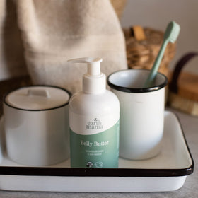 Earth Mama Belly Butter packaging highlights value for long-lasting moisture.