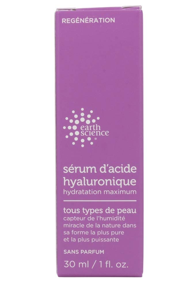 Earth Science Hyaluronic Acid Serum in hand ready for application.