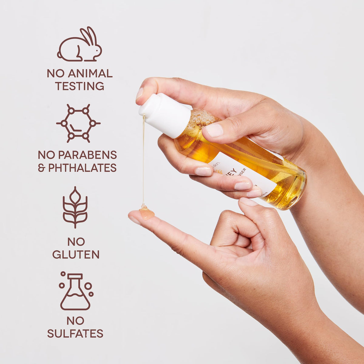 Applying Earth To Skin Manuka Honey Serum to the face for morning routine.