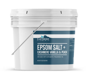 Earthborn Elements Cashmere Vanilla & Peach Epsom Salt dissolving in warm bath water