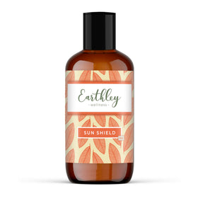 Earthley Wellness Sun Shield bottle pour for quick daily application.