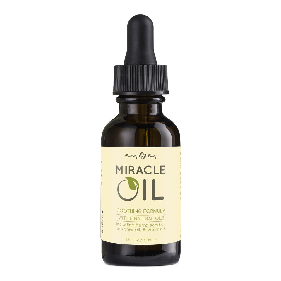 Earthly Body Miracle Oil bottle closeup highlighting natural blend for moisturizing and soothing skin.