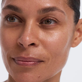 EarthsCure antiaging bottle close-up highlights fragrance-free formula for sensitive skin