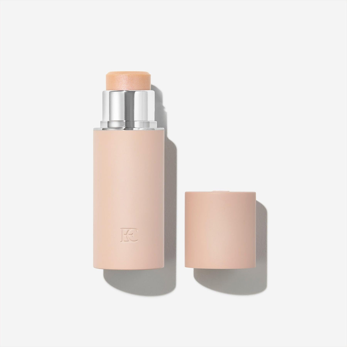 EarthsCure Glow Glaze highlighter stick in coral undertone for radiant complexion.