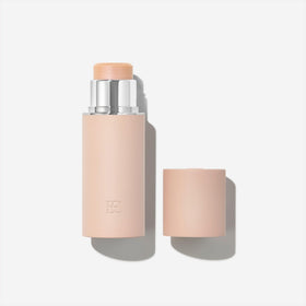EarthsCure Glow Glaze highlighter stick in coral undertone for radiant complexion.