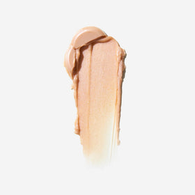 EarthsCure Glow Glaze highlighter stick with violet undertone adds dimensional luminosity.