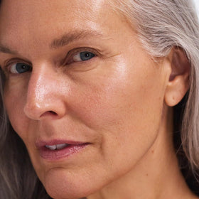 EarthsCure Hybrid Retinol Cream application scene suggests night-time care ritual