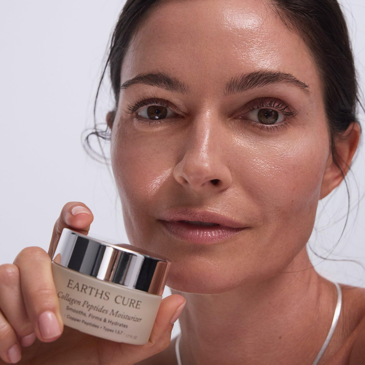 EarthsCure Nano Peptide Moisturizer applied to neck and chest for a firmer feel.