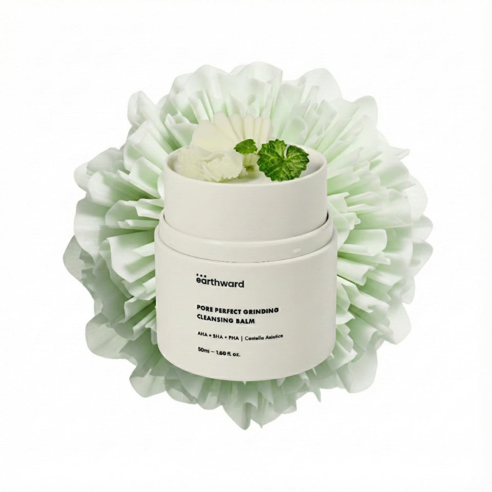 EARTHWARD Pore Perfect Grinding Cleansing Balm bottle pour demonstrates fresh, convenient makeup removal.