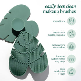 Brush and sponge being cleansed with plant-based shampoo