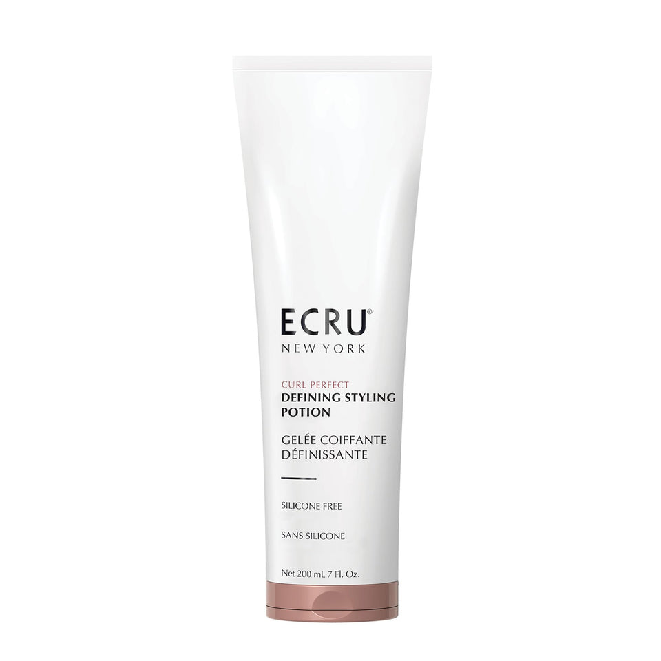 ECRU New York Curl Perfect Defining Potion bottle pour for smooth frizz control.