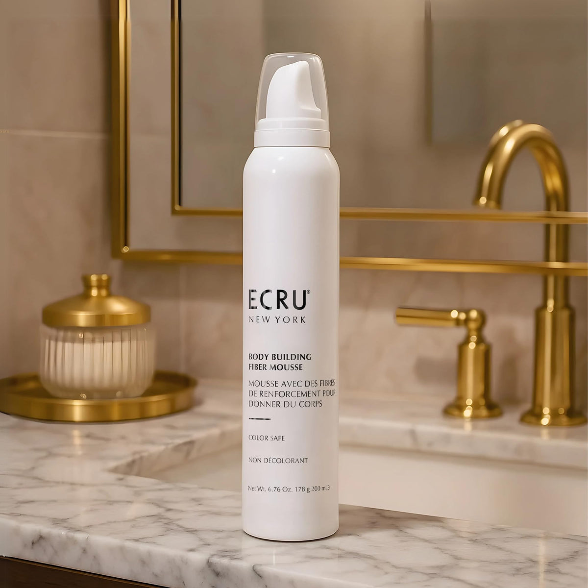 ECRU New York mousse-application hand shot emphasizes easy distribution.