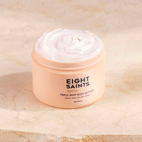 Eight Saints Cocoa Creme jar close-up, rich texture for moisturized skin.