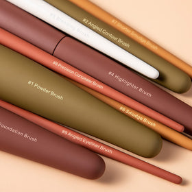 Eigshow fluffy powder brush for even setting and soft finish.
