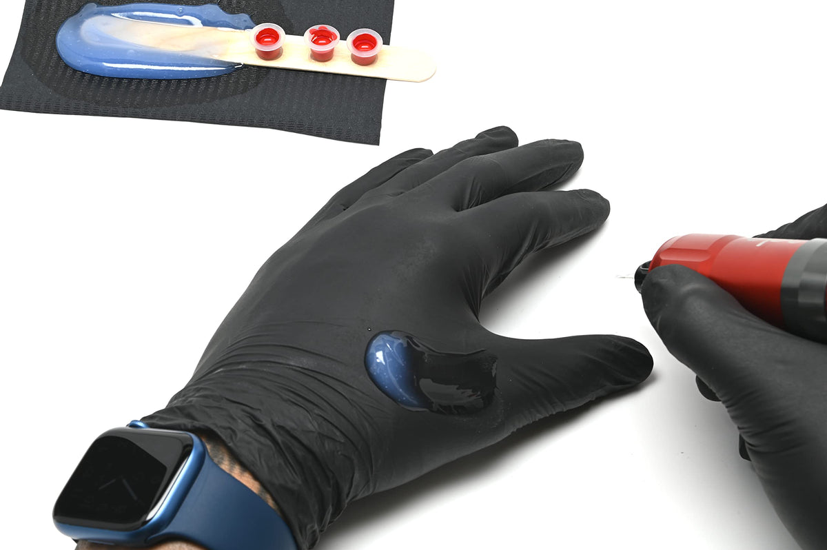 Professional artist uses Guardian Tattoo Glide Gel in a studio.