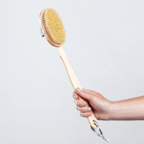 Exfoliation action of the ELEMIS brush highlighting skin smoothing potential.