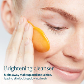 ELEMIS Superfood AHA Glow Butter texture closeup reveals a creamy butter-to-milk formula for gentle cleansing.