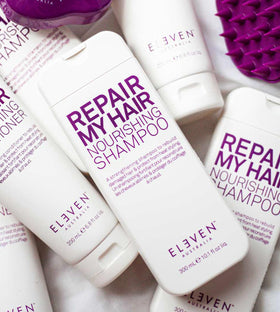 ELEVEN AUSTRALIA Repair My Hair Nourishing Shampoo label closeup featuring green tea and aloe