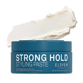 ELEVEN AUSTRALIA Strong Hold paste jar close-up shows creamy texture for versatile styling.