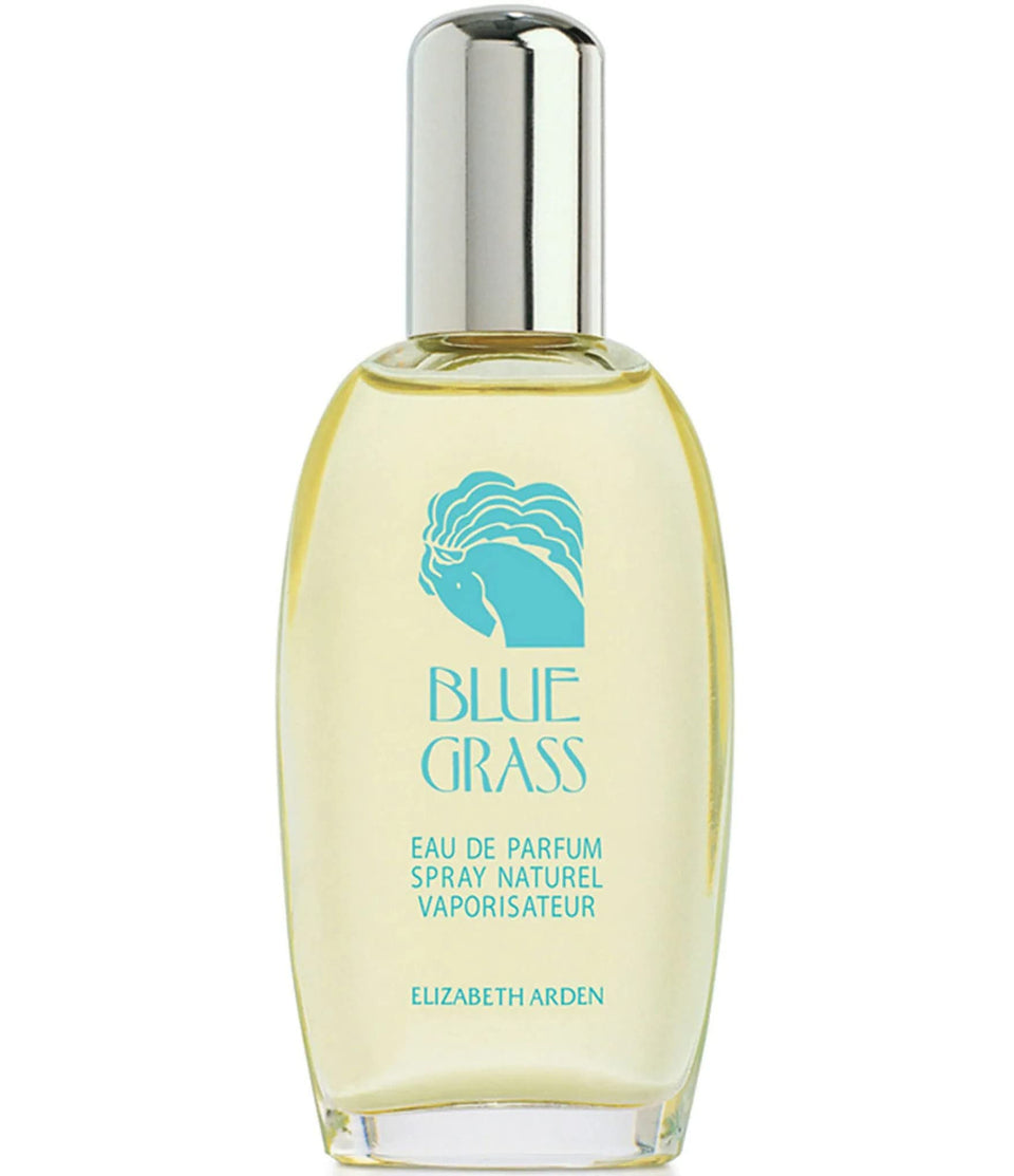 Elizabeth Arden Elk2i Blue Grass bottle on vanity, elegant evening ritual.
